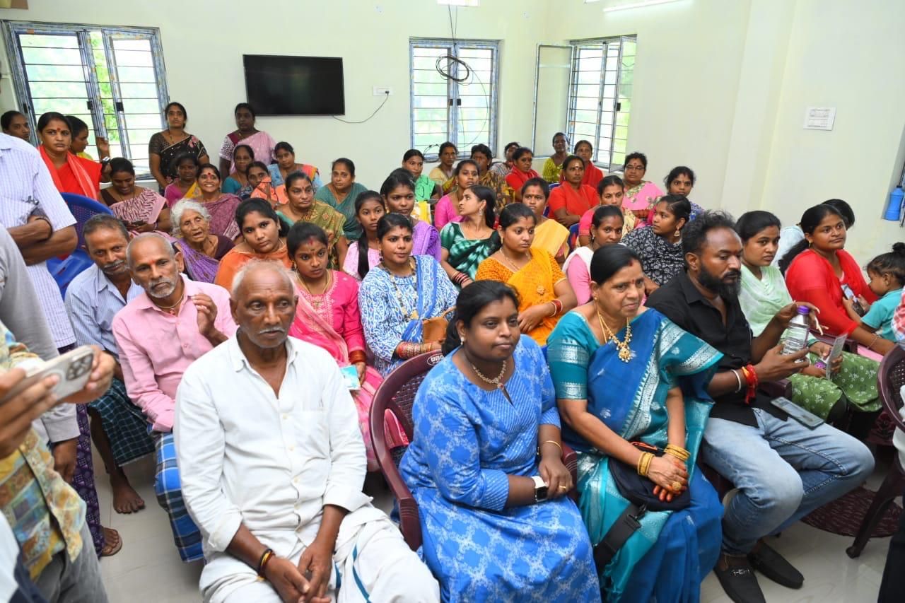 Women farmers and villagers gathered at an awareness meeting